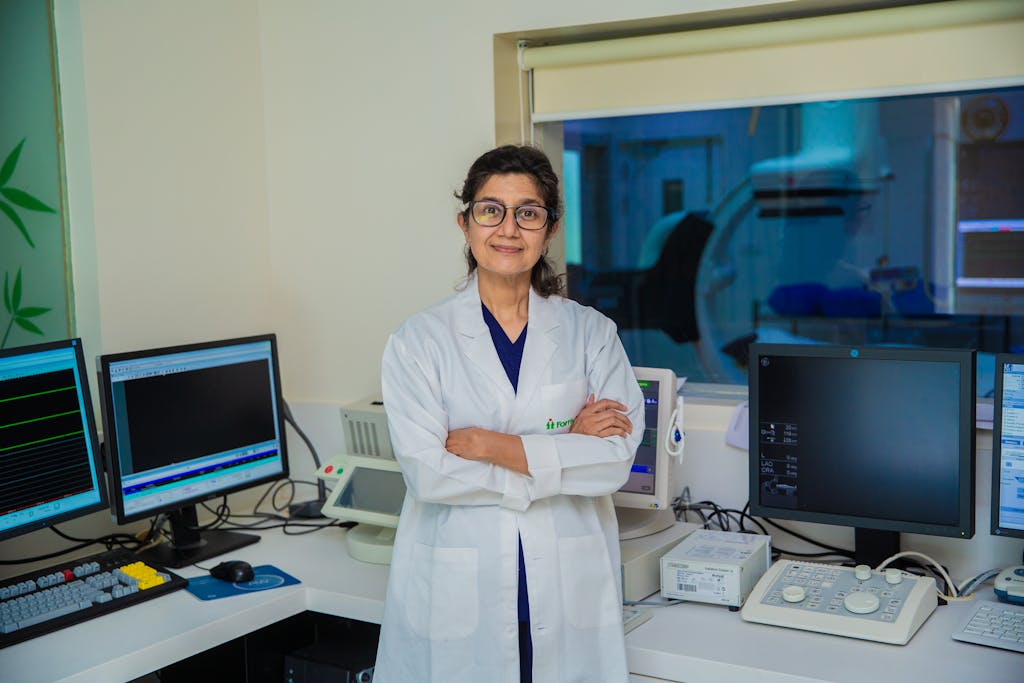 Photo of a Doctor Standing with her Arms Crossed